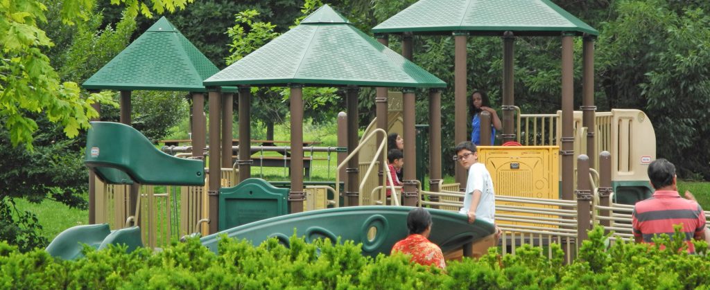 feature-spring-HOM_playground_spring-summer-MikeHeisey Kids on the play equipment at Homestead Metro Park